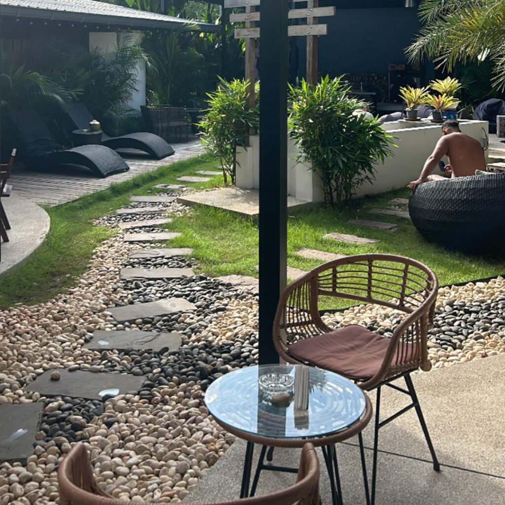 Cozy outdoor seating at a wellness café in Koh Samui, Thailand — perfect spot for digital nomads to relax or work in a tranquil setting